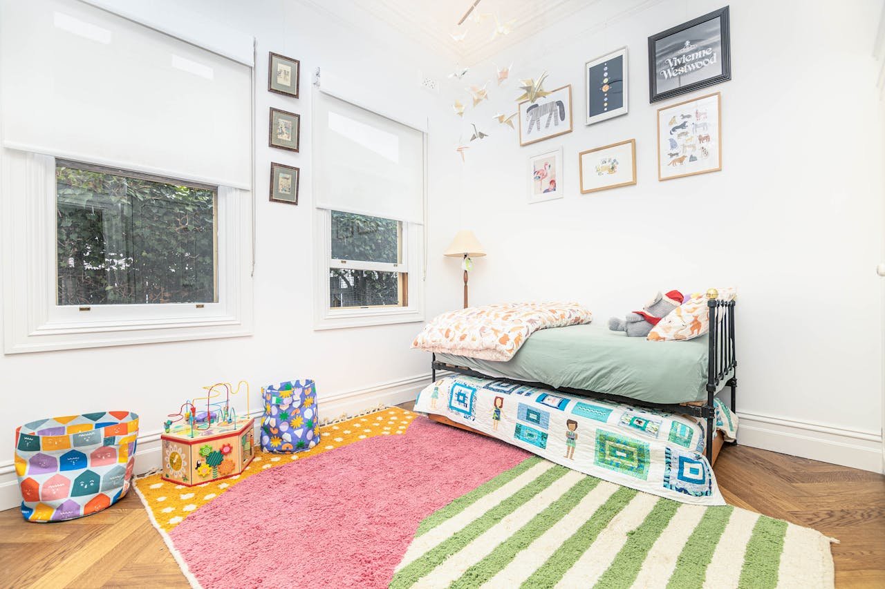Bright and cozy child's bedroom with colorful decor and playful elements.